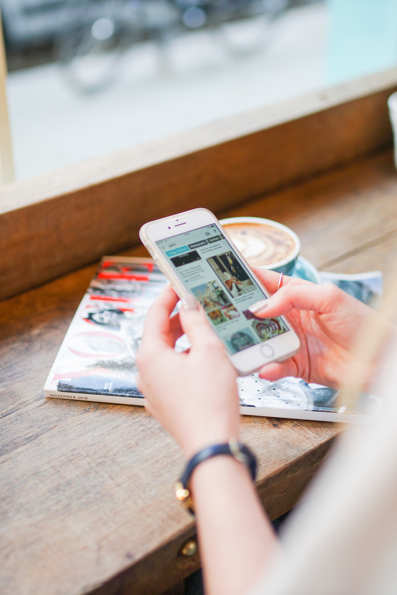 Hands Scrolling on Smartphone